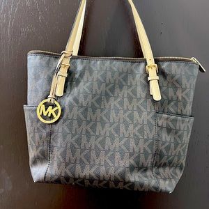 Authentic MK bag, few years old has seen better days. Perfect for you!